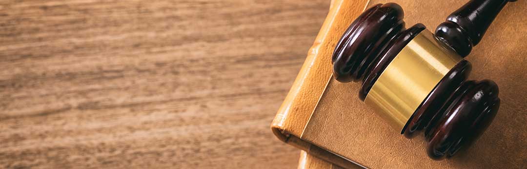 Gavel to indicate court.