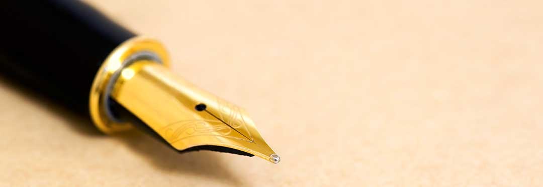 A fountain pen denoting the writing on a last will and testament.