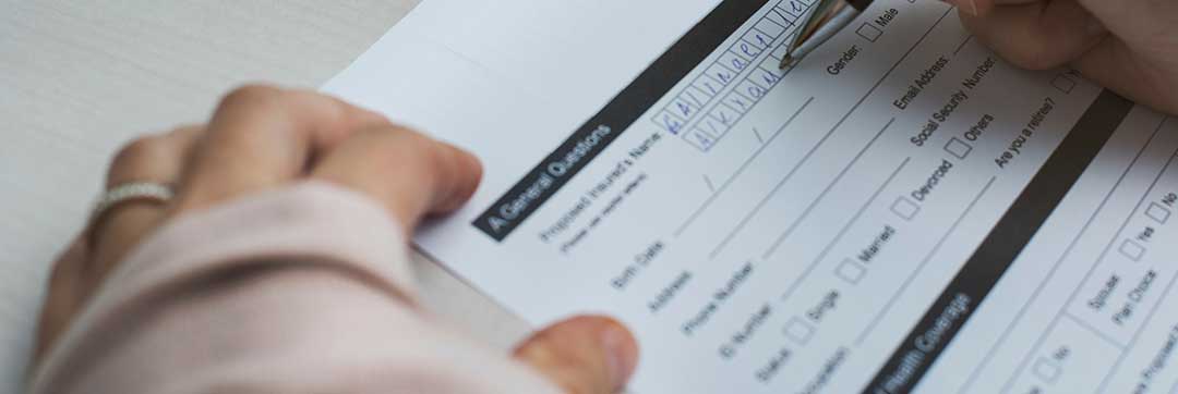 A lady filling out the petition and beginning the process of legal separation with the family court.