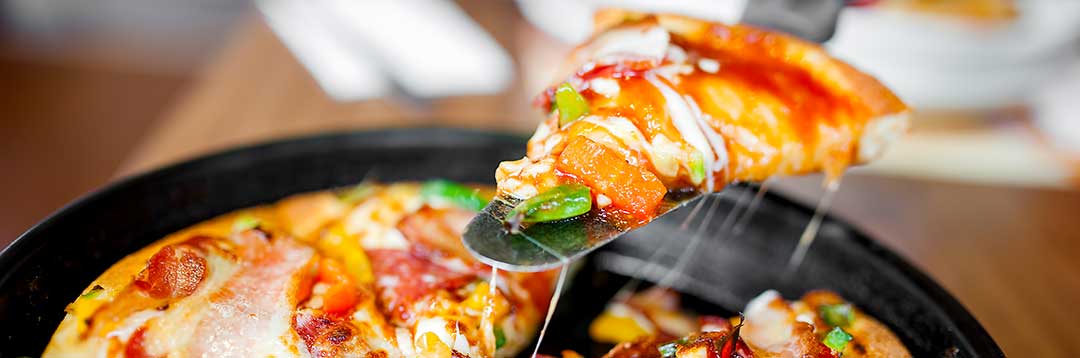 A pizza divided into slices. All of the slices went to the wife as she was deemed the spouse without fault.