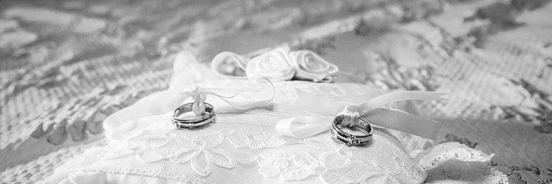 Wedding rings on a pillow to illustrate the Quiao marriage, which was governed by the conjugal partnership of gains regime.