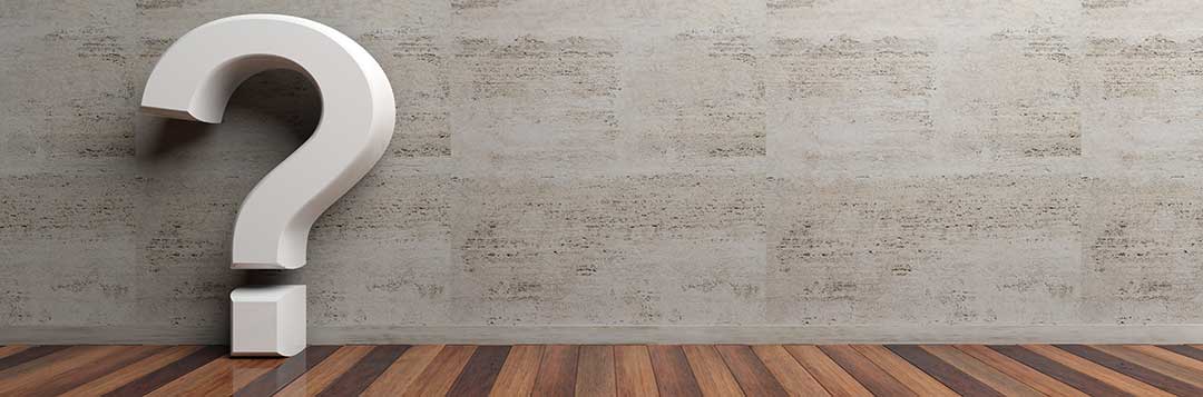 A white 3D question mark on a wooden floor, leaning against a grey granite wall. Inheritance rights of a surviving Spouse Philippines