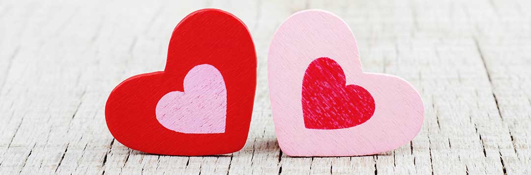 A red heart with a smaller central pink heart inside, and a Pink heart with a smaller central red heart inside next to it other on white wooden floorboards to symbolize a separated couple reconciling. Can the Marital Property Regime be revived after a Judicial Separation of Property?