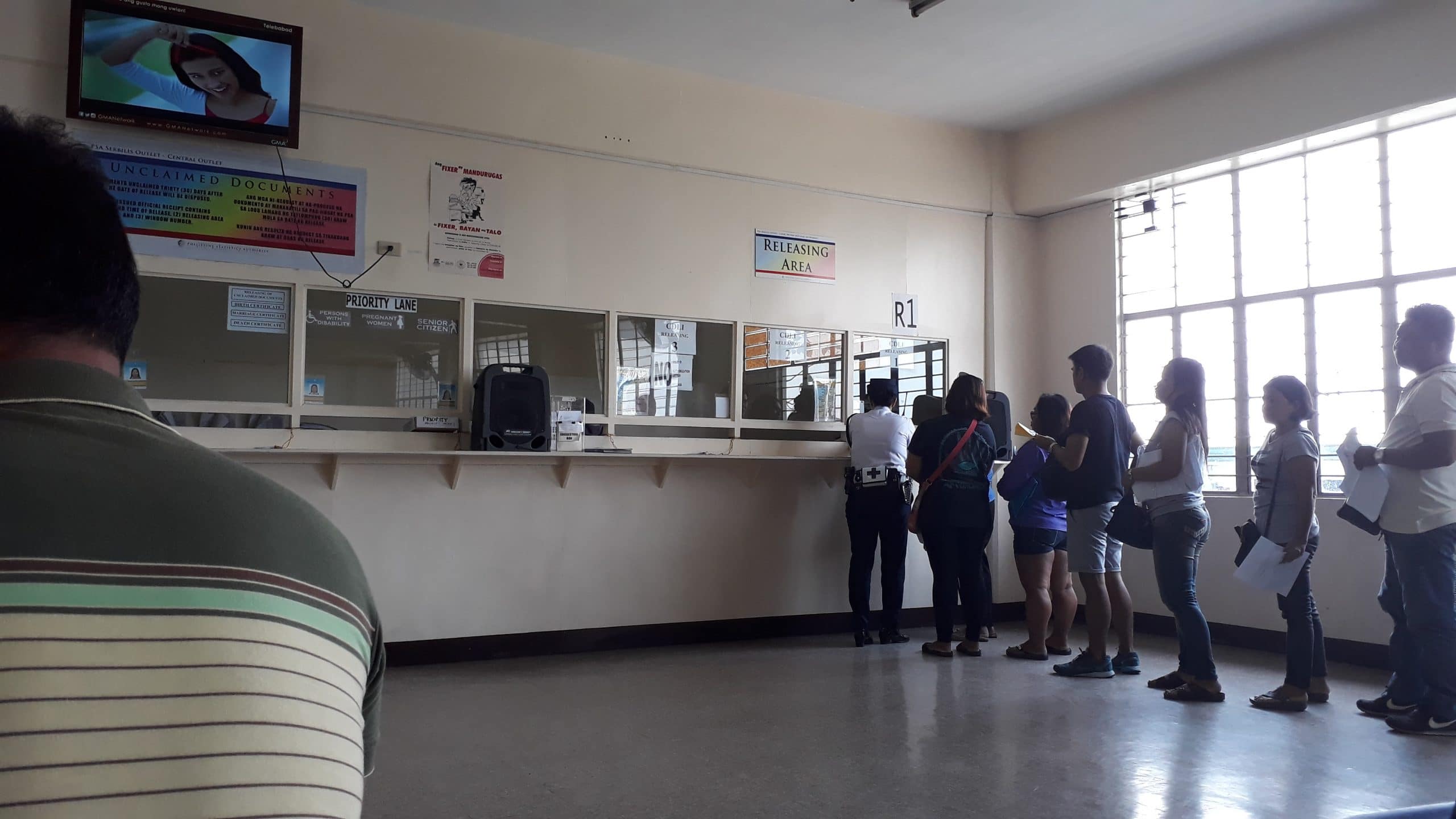 A man waiting for his name to be called in the DFA waiting section