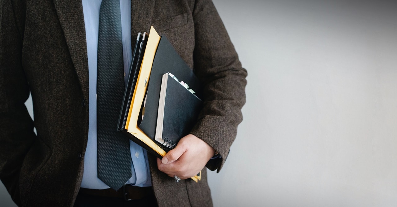 A lawyer holding files