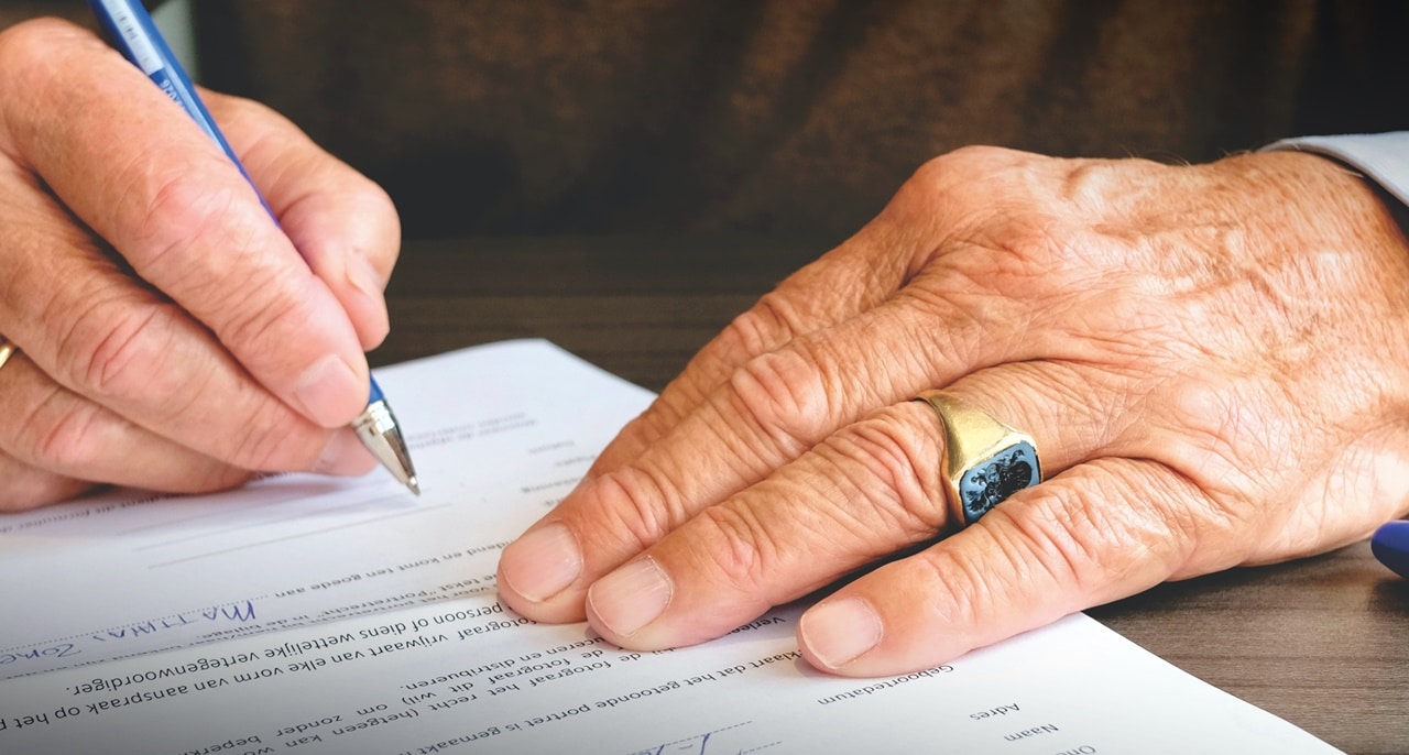 A man signing an affidavit