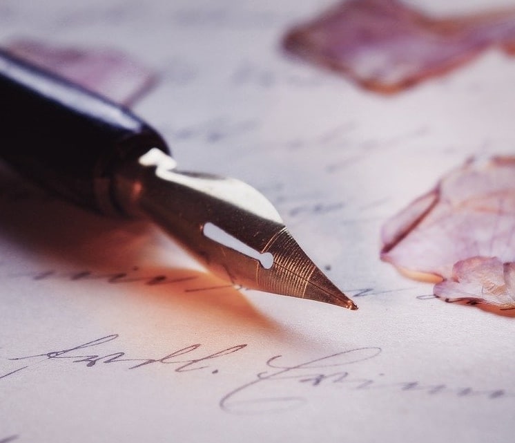 A black fountain pen resting on top of paper which has a handwritten Last Will and Testament Philippines?