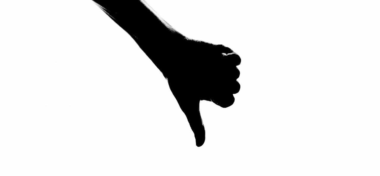 A shadow of thumbs down