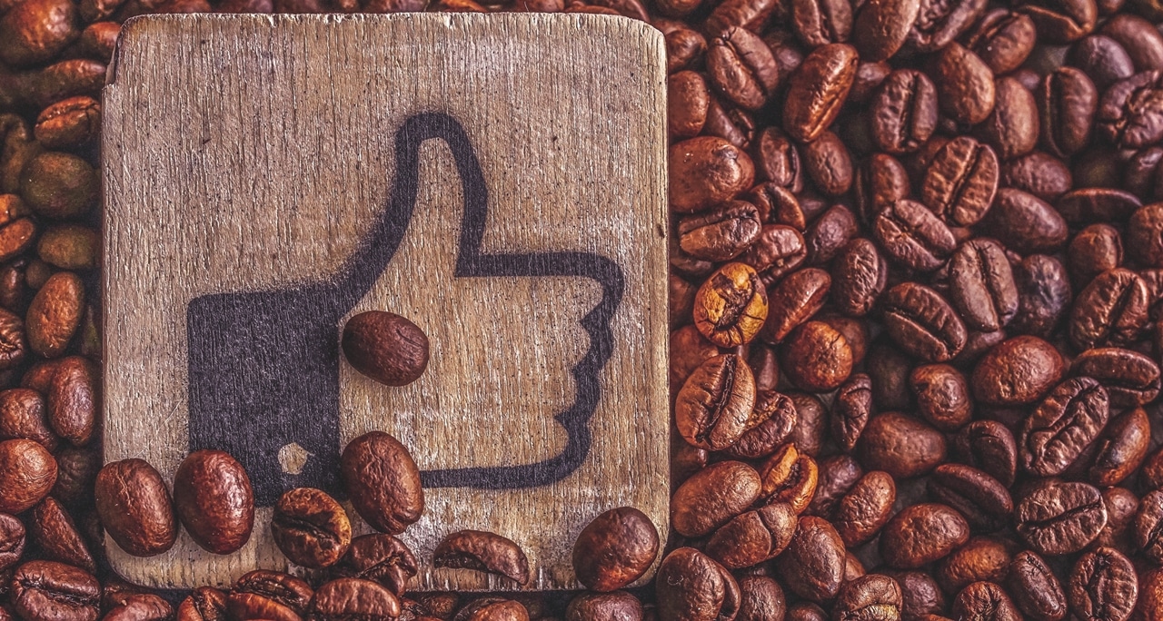 Thumbs up and coffee beans