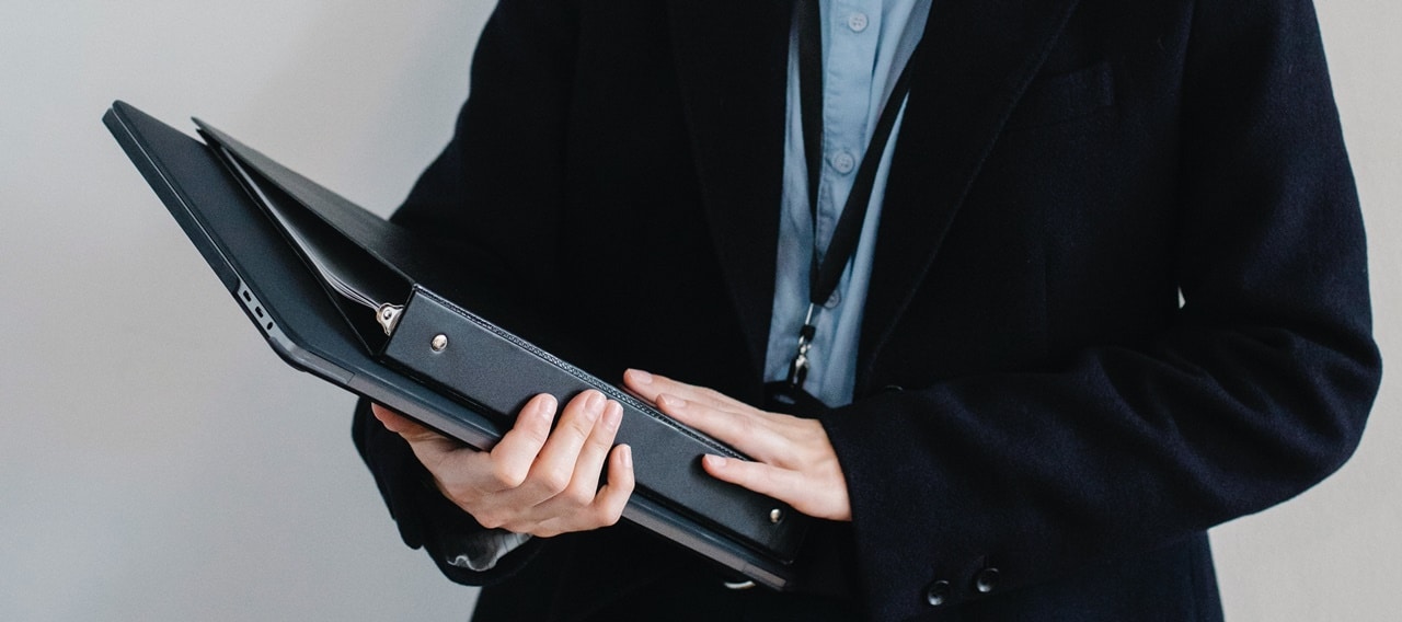 A picture of a lady holding folders