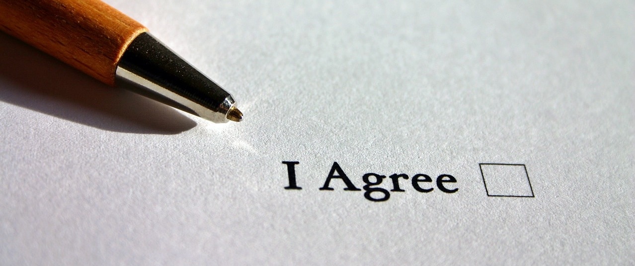 A pen pointed at the word "agree"