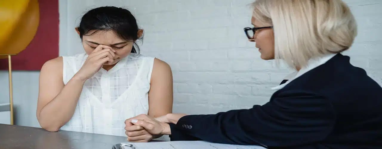 An agent of a foreign company discussing with a corporate lawyer regarding representative offce taxation.