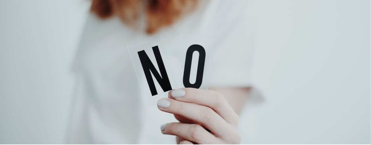 A woman holding letters of