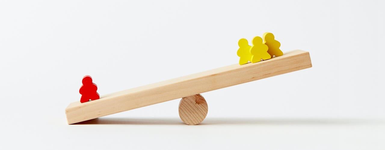 Human shaped blocks weighing on a wooden seesaw symbolizing that the BIR LOA must be served fair.