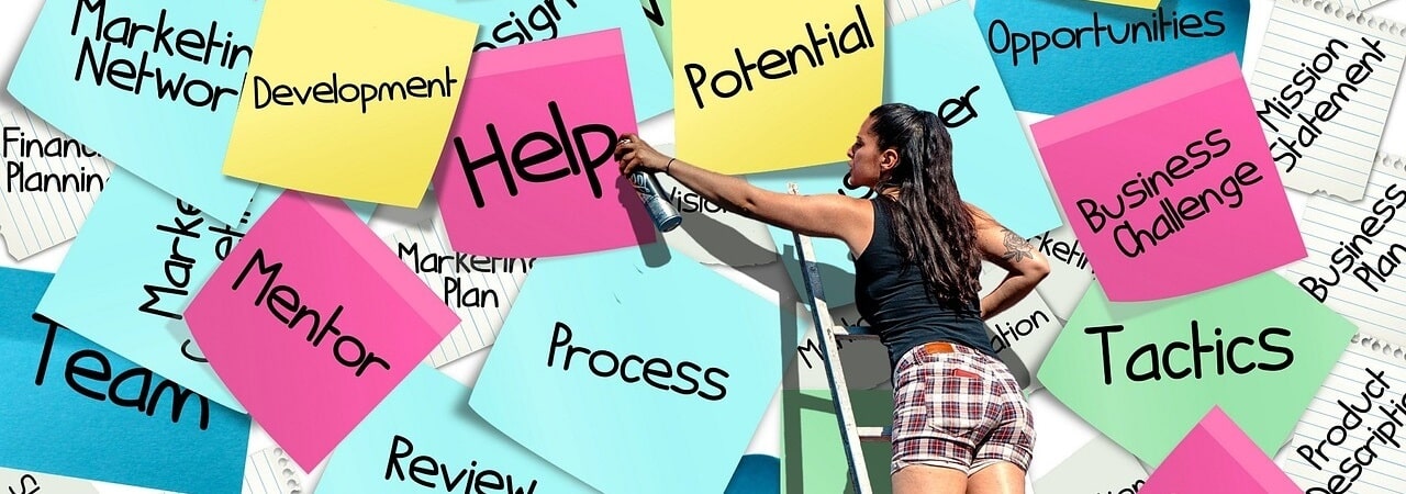 A lady posting sticky notes asking for help to incorporate in the Philippines