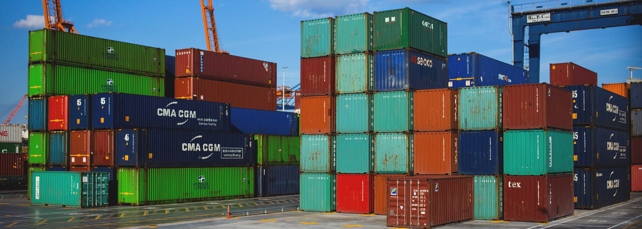 Shipping containers sitting on a port