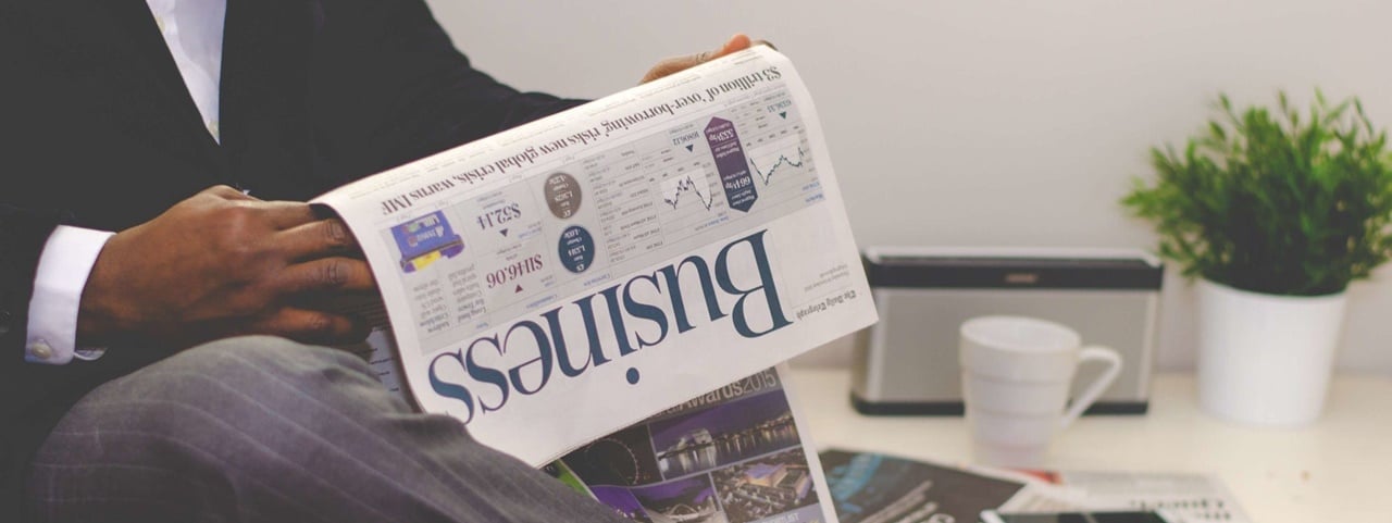 A businessman reading news about incorporation in the Philippines and TITF.