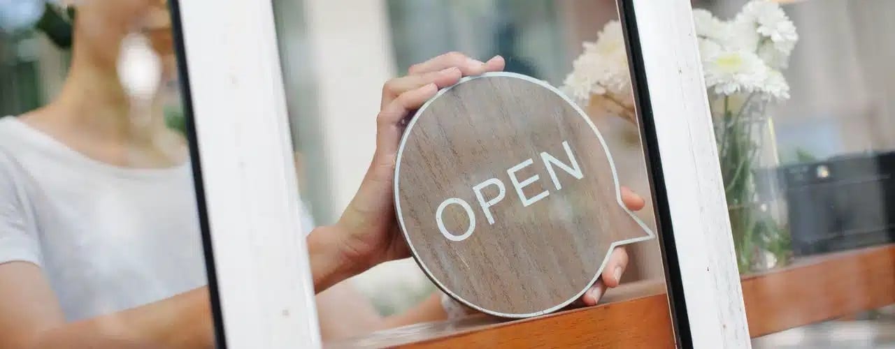 Business owner opening her new business address after transfer of business address.