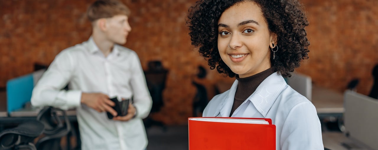 A woman holding corporate bank account requirements in the Philippines for TITF.