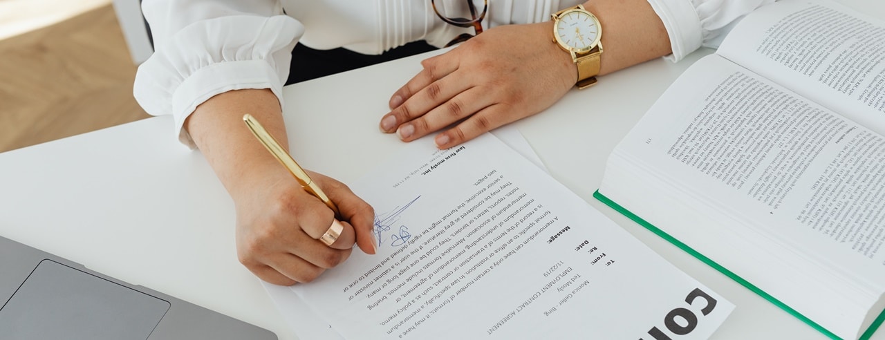 A woman signing corporate bank account requirements Philippines for TITF.