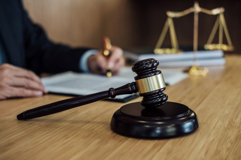 Judge gavel with Justice lawyers, Businessman in suit or lawyer working on a documents. Legal law, advice and justice concept