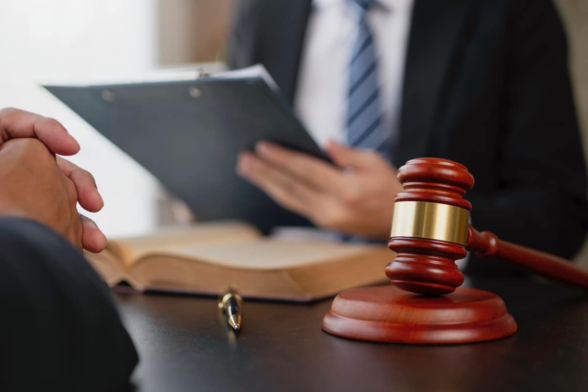 Lawyer or judge provides legal advice to clients in the courtroom. including the impartiality of the contract terms Details of the lawsuit, fairness and agreement.