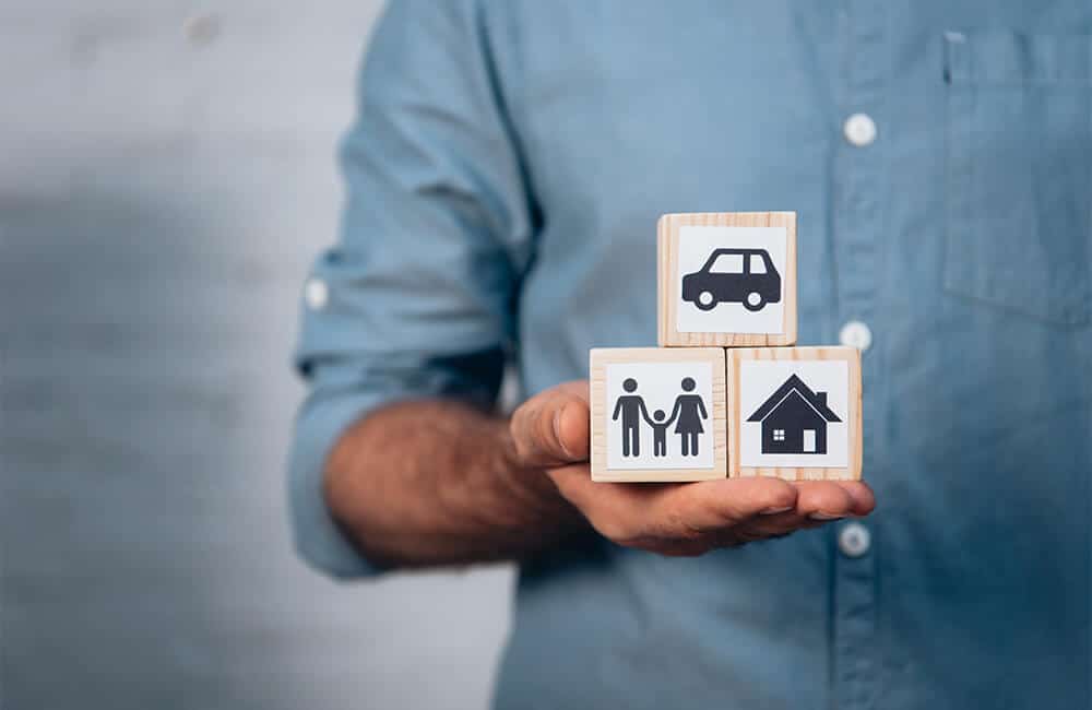 Three blocks showing a family and assets symbolizing that the Will's stipulations on the division of assets were followed.