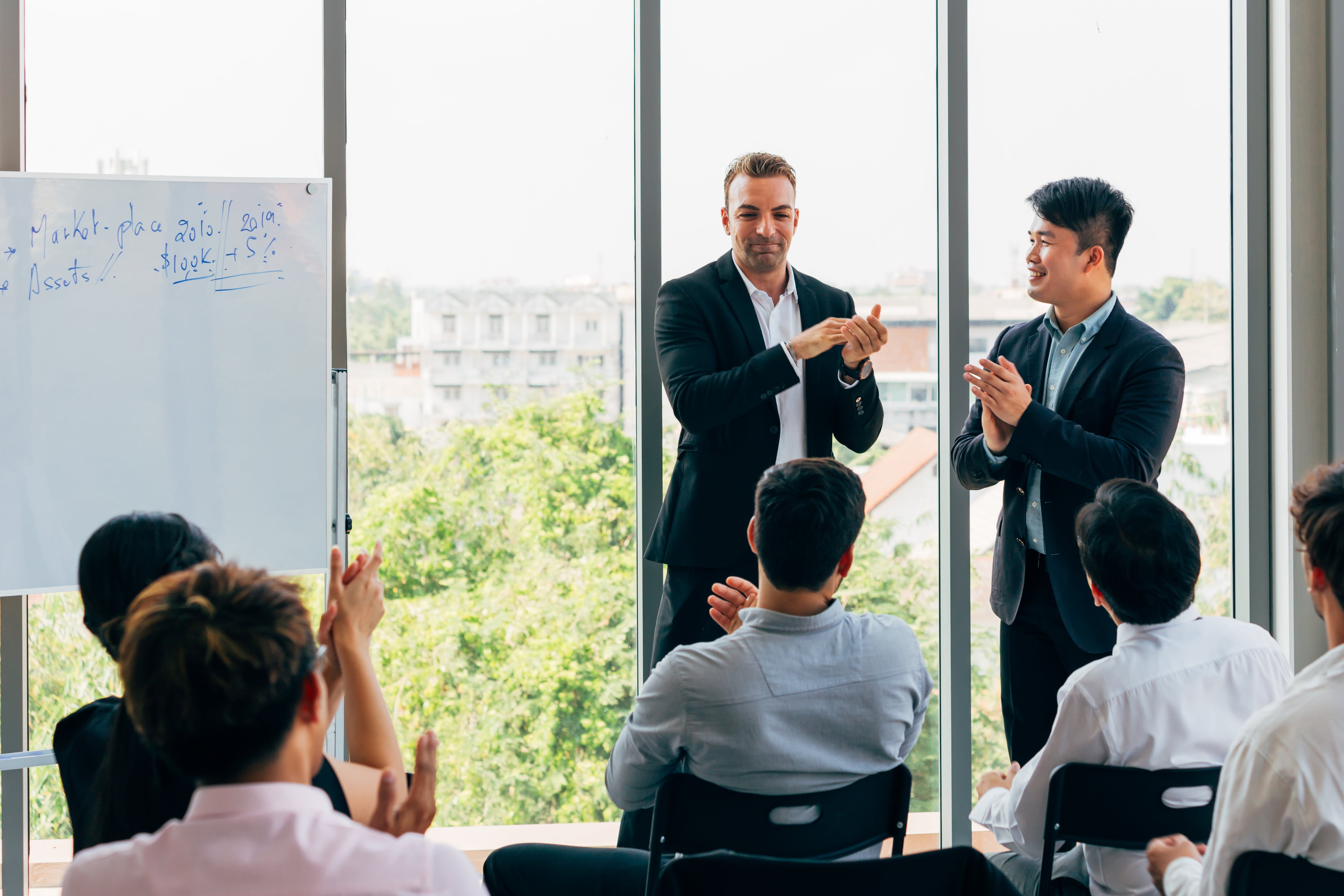 A group of business people meeting symbolizng the complete Board of Directors that a Domestic Corporation must have.