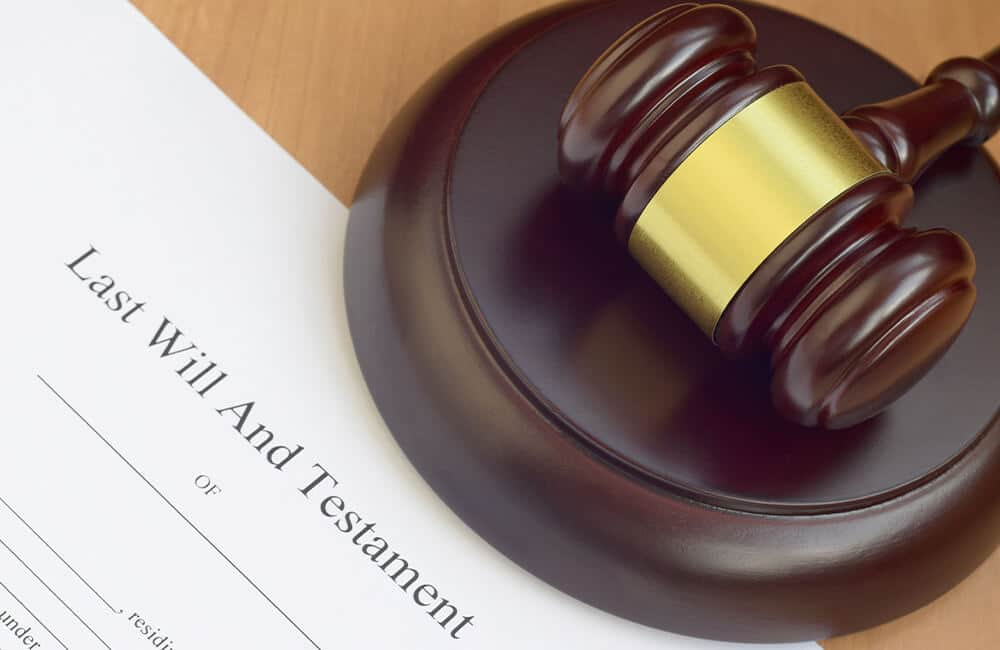 A gavel on top of a Will. FCB Law will draft the Will correctly to be sure that the Will can be used and that it is compliant with PH Succession Laws