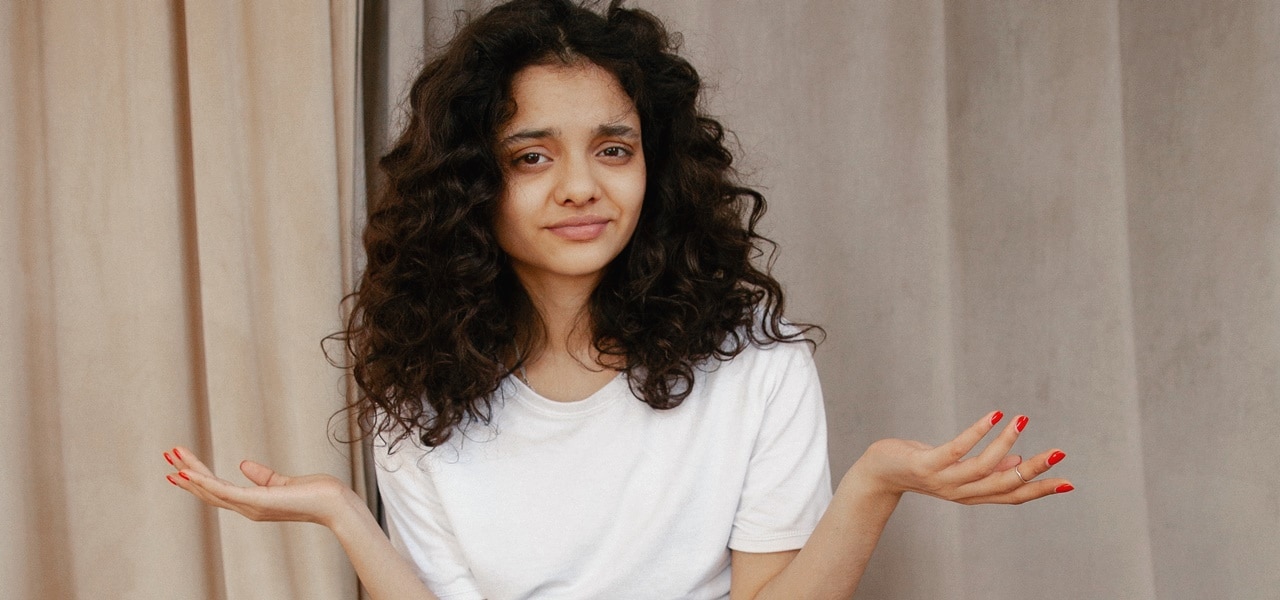 A woman shrugging her shoulder