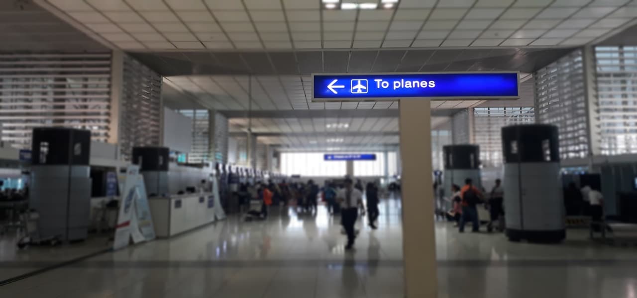 Inside an airport hallway leading to the departure