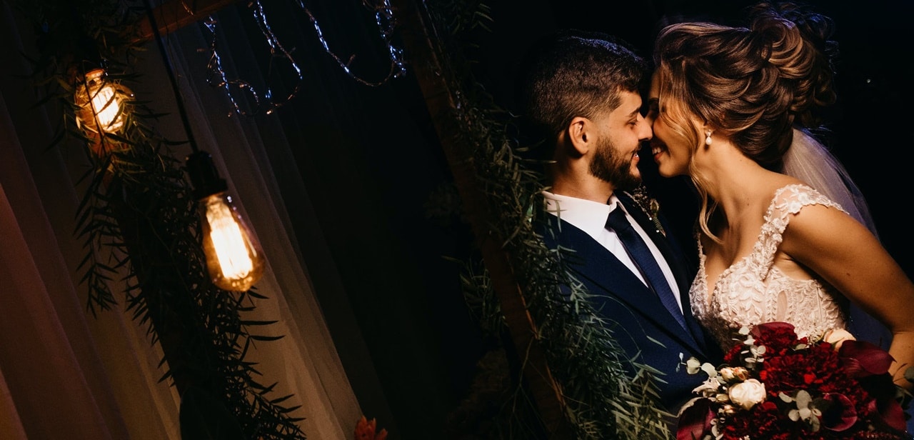 A man and a woman kissing in a dark room