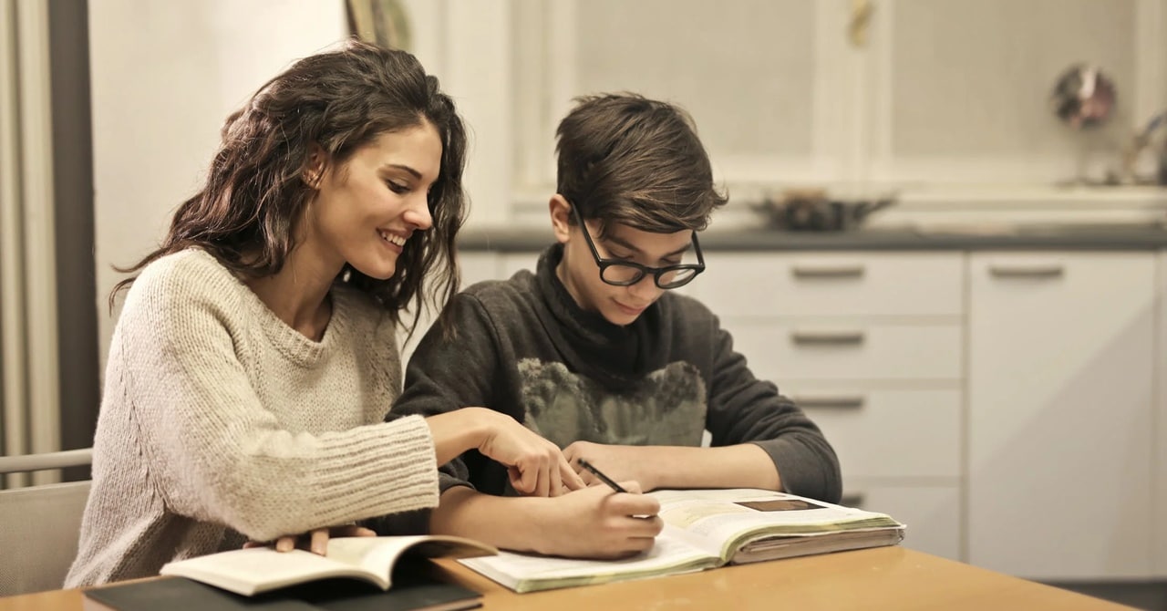 A woman tutoring her child
