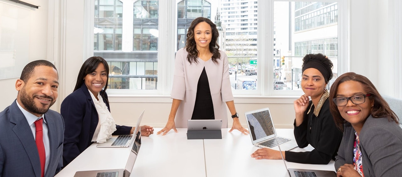People in formal attire on a meeting