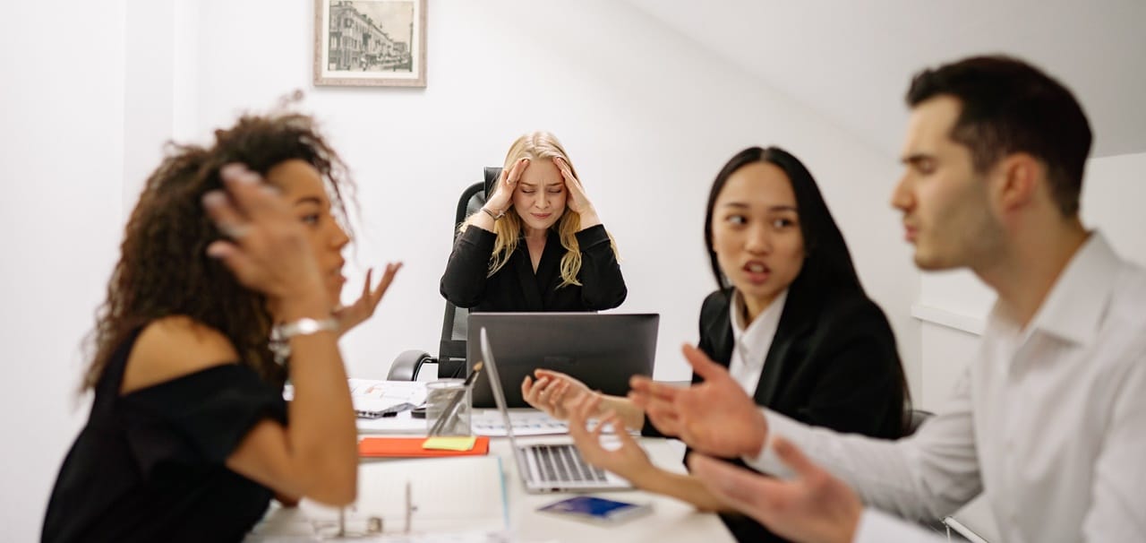 People fighting during a meeting