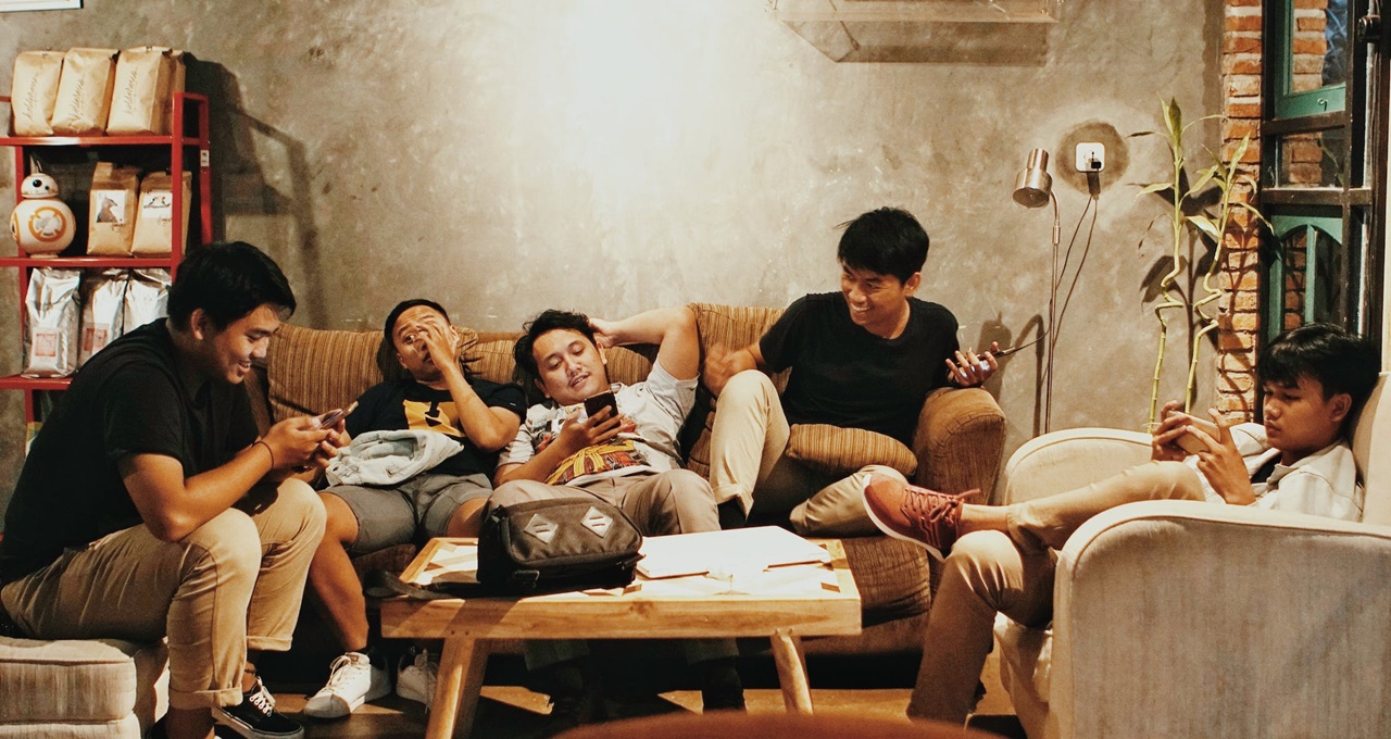 Group of young men bonding in the living room