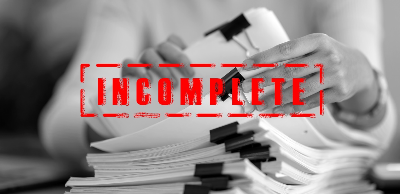 A person checking paper works with